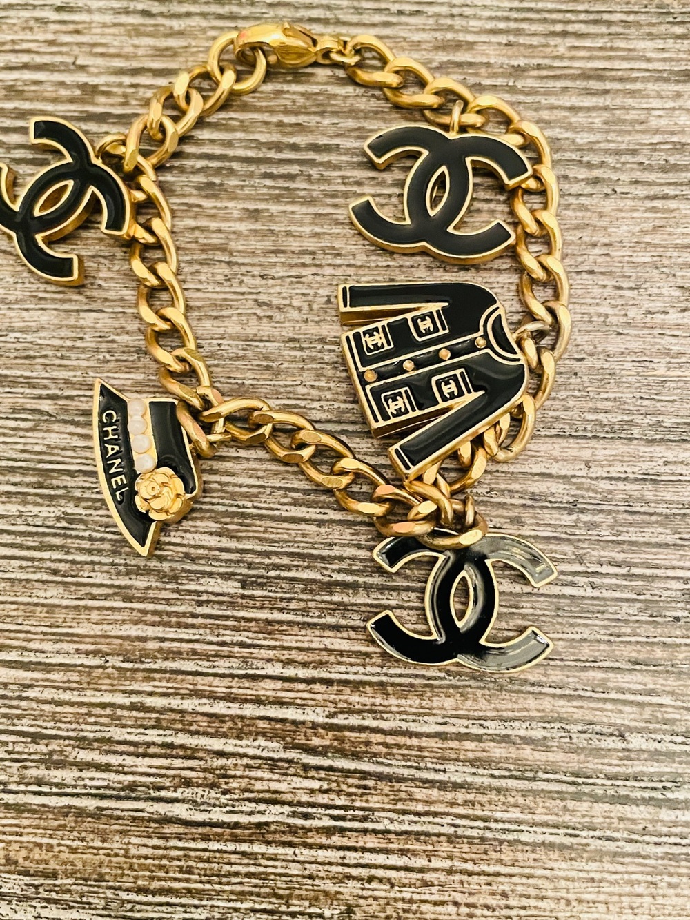 CHANEL Black and Gold Charm Bracelet size 7 inch